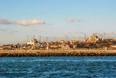 Water during the day near the city skyline
